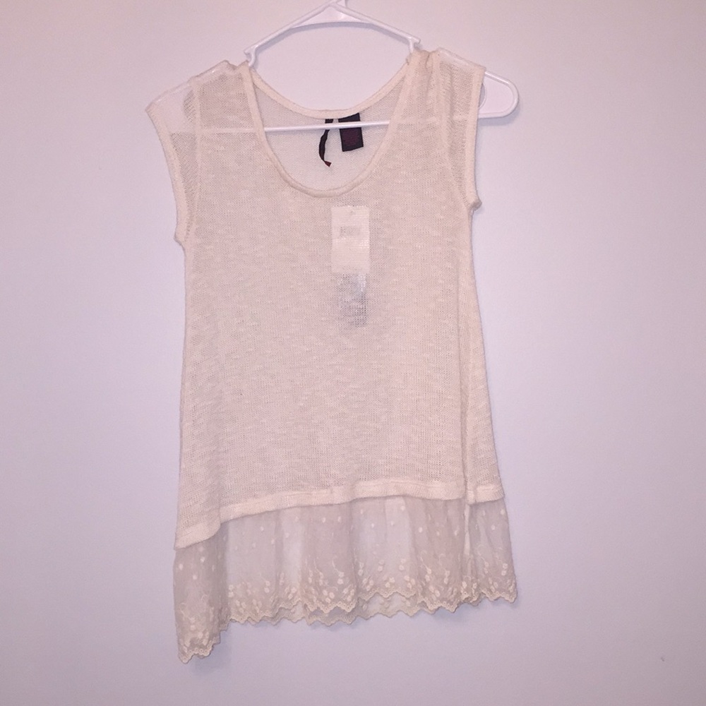 Knit cream top with lace detailing at the bottom